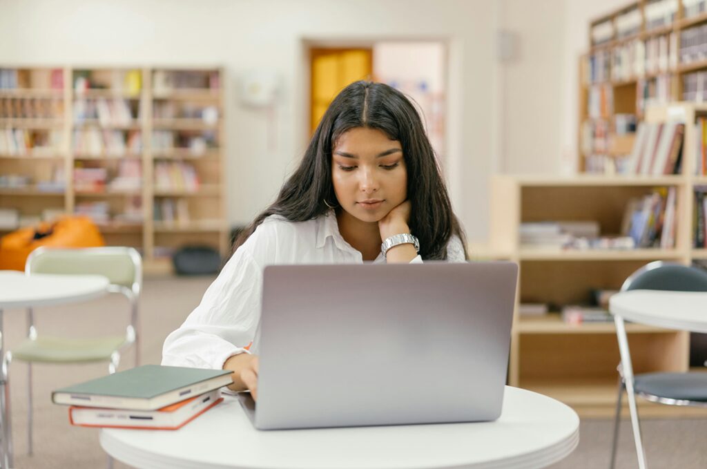 Person Studying Languages with Books